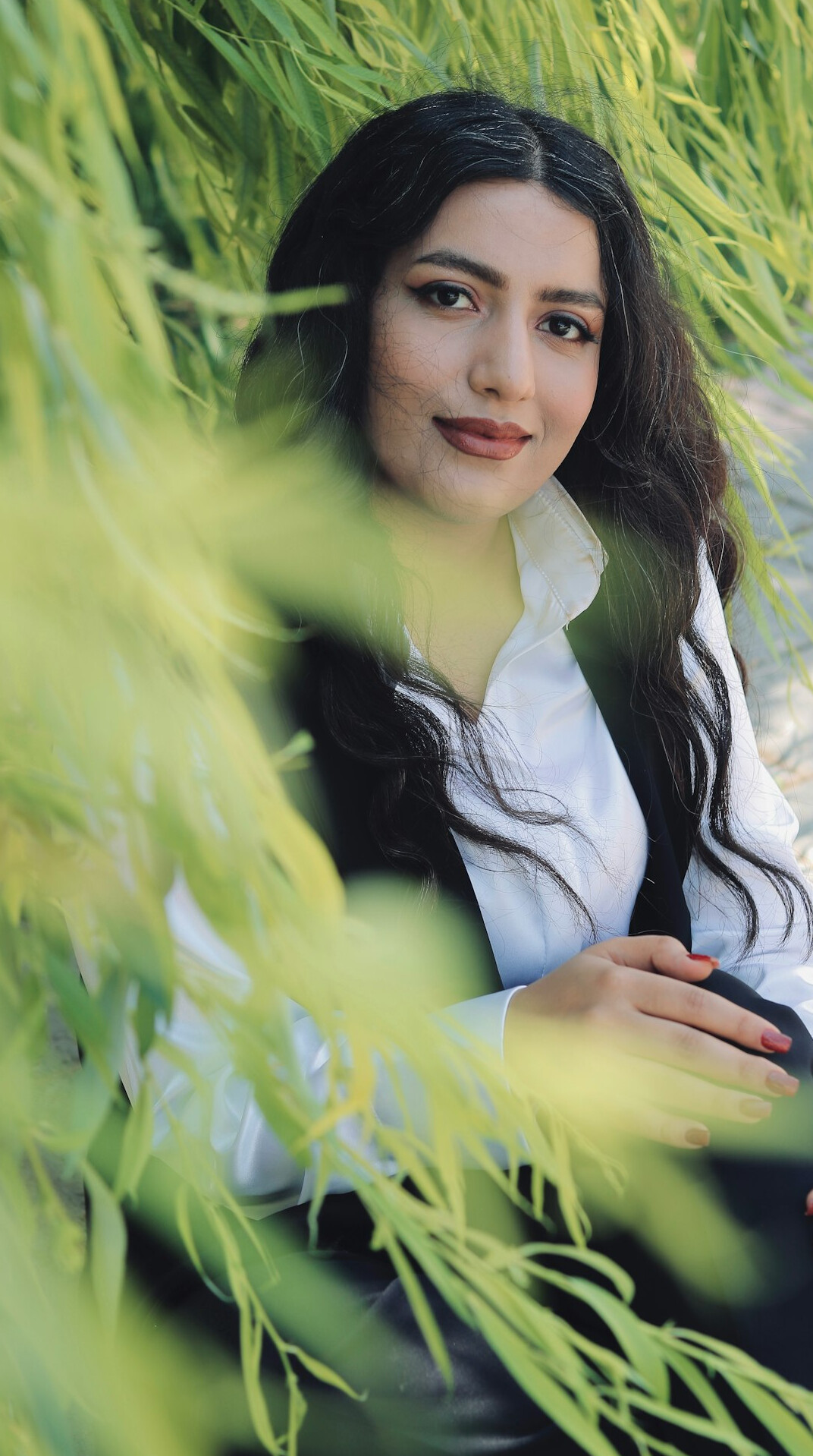 Portrait of a smiling young woman with long hair