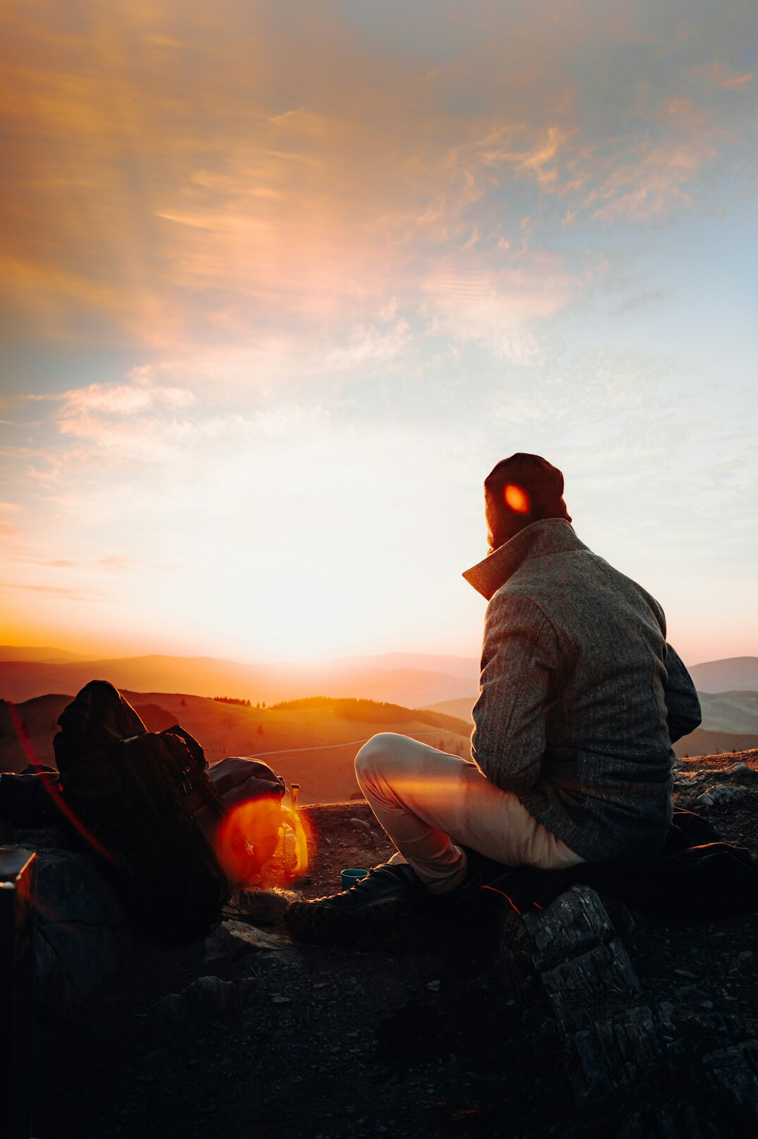 person meditating at sunrise